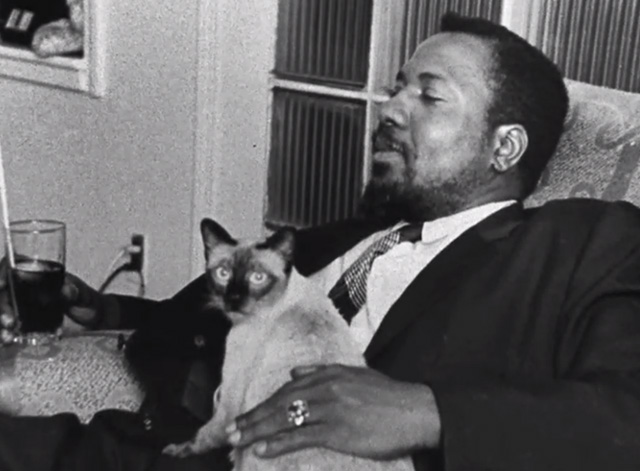Thelonious Monk holding a cat