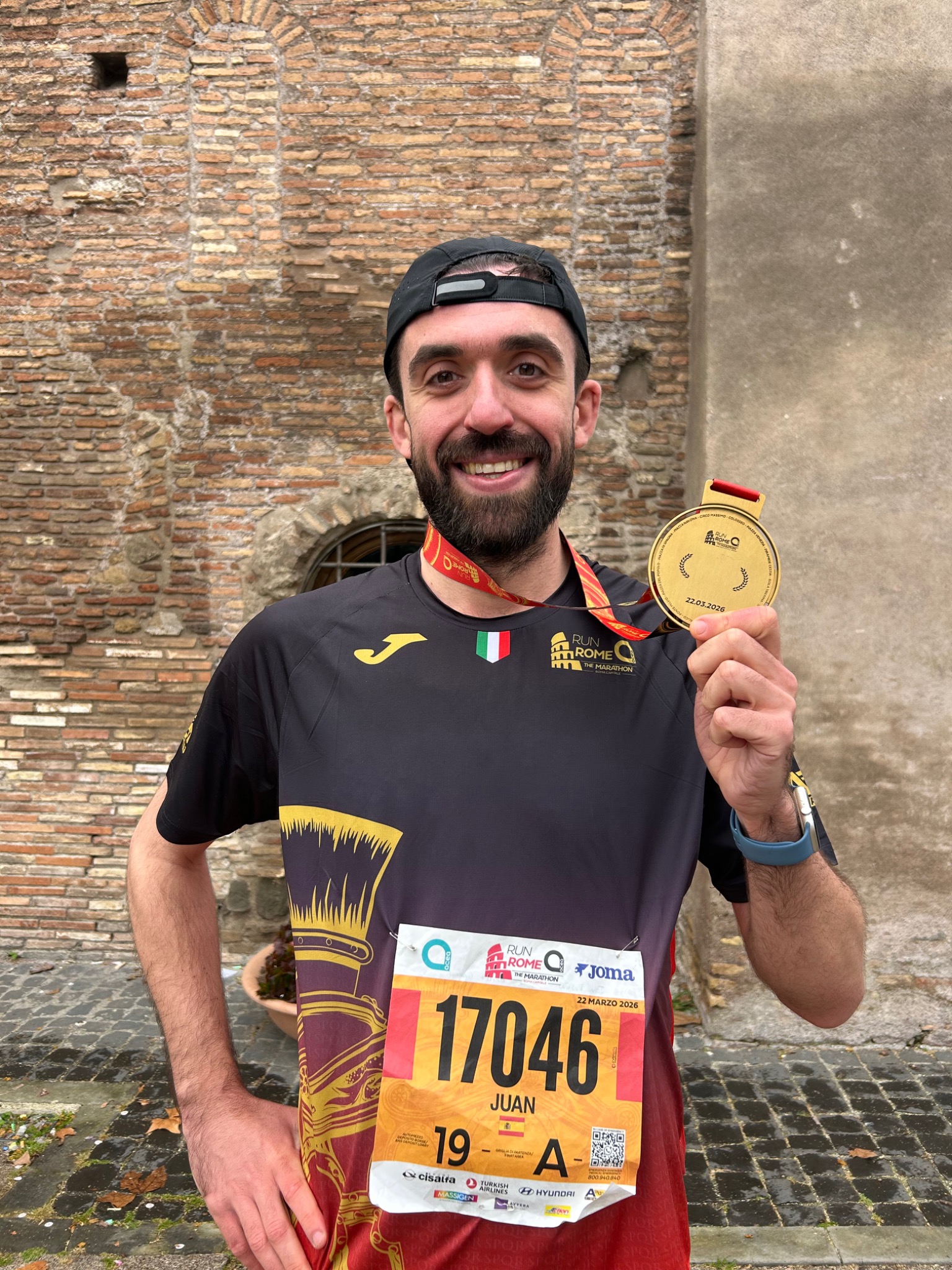 Juan Ramón with his medal after the 2026 Rome Marathon